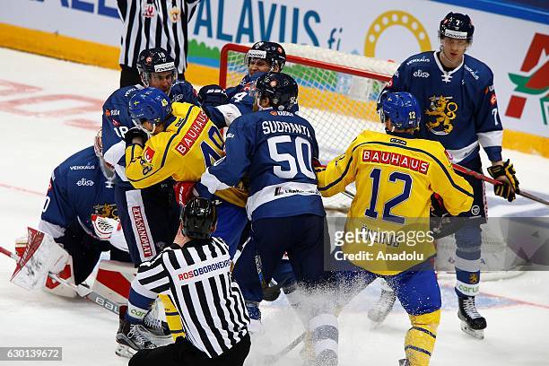 Players of Finland clash with players of Sweden during the Euro Hockey tour Channel One Cup match between Finland and Sweden at the VTB Ice Palace in...