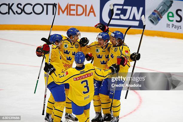 Players of Sweden celebrates with his teammates after scoring during the Euro Hockey tour Channel One Cup match between Finland and Sweden at the VTB...