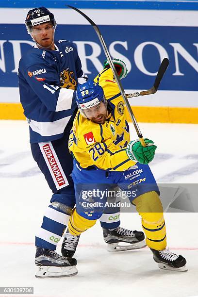 Joona Nattinen of Finland in action against Ludvig Rensfeldt of Sweden during the Euro Hockey tour Channel One Cup match between Finland and Sweden...