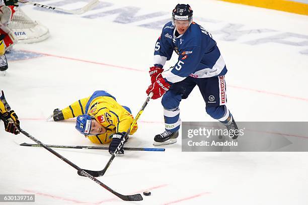 Miro Aaltonen of Finland in action against John Norman ) of Sweden during the Euro Hockey tour Channel One Cup match between Finland and Sweden at...