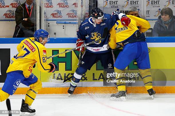 Miro Aaltonen of Finland in action against John Norman of Sweden during the Euro Hockey tour Channel One Cup match between Finland and Sweden at the...