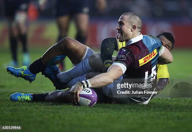 Mike Brown of Quins celebrates scoring a try during the European Rugby Challenge Cup match between Harlequins and Timisoara Saracens at Twickenham...