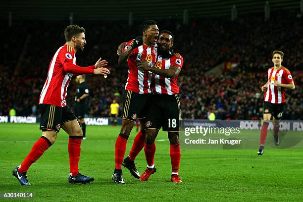 Patrick van Aanholt of Sunderland celebrates scoring his sides first goal with Jermain Defoe of Sunderland during the Premier League match between...