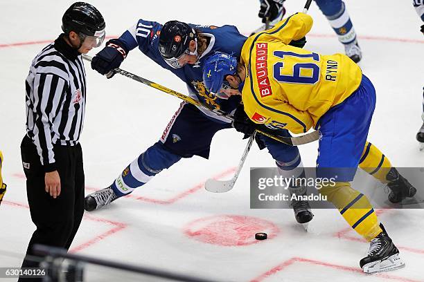 Roope Hintz of Finland in action against Johan Ryno of Sweden during the Euro Hockey tour Channel One Cup match between Finland and Sweden at the VTB...