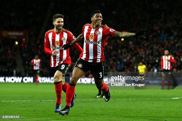 Patrick van Aanholt of Sunderland celebrates scoring his sides first goal with Fabio Borini of Sunderland during the Premier League match between...