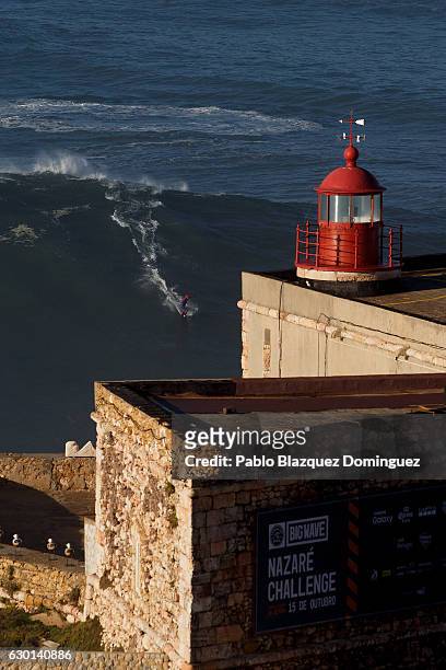 French Brazilian surfer Eric Xavier rides a big wave at Praia do Norte on December 17, 2016 in Nazare, Portugal. Nazare's giant waves are...