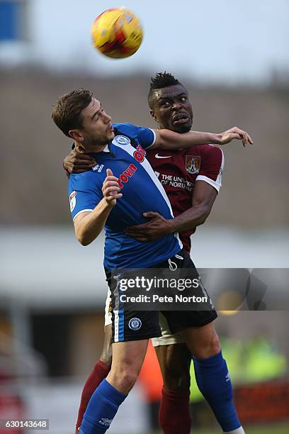 Gabriel Zakuani of Northampton Town contests the ball with Steven Davies of Rochdale during the Sky Bet League One match between Northampton Town and...