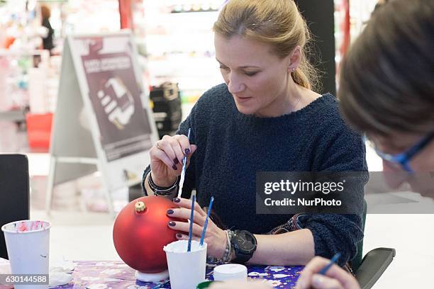 Multiple World and European champion in kick-boxing and boxing Iwona Guzowska takes part in the charity Christmas baubles painting in CH Klif...