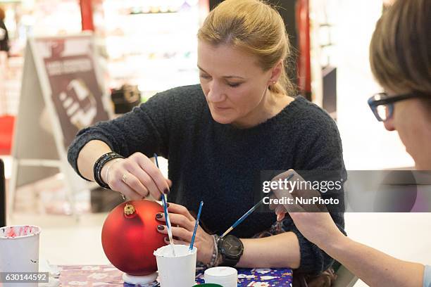 Multiple World and European champion in kick-boxing and boxing Iwona Guzowska takes part in the charity Christmas baubles painting in CH Klif...