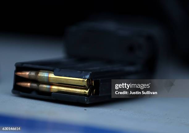 Surrendered assault rifle magazine with bullets sits on a table during a gun buyback event on December 17, 2016 in San Francisco, California. Dozens...