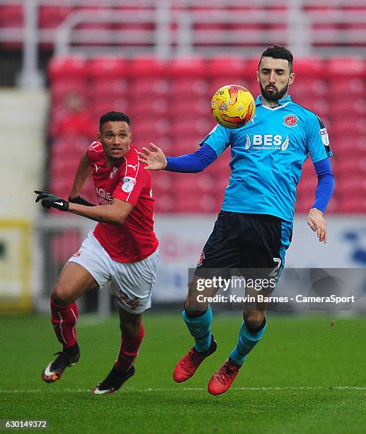 Fleetwood Town's Conor McLaughlin under pressure from Swindon Town's Jermaine Hylton during the Sky Bet League One match between Swindon Town and...