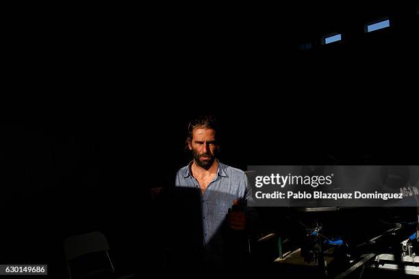 Portuguese surfer Hugo Vau walks at his warehouse as he looks on after a big wave session on December 17, 2016 in Nazare, Portugal. Nazare's giant...