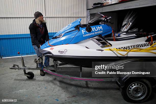 Russian surfer Andrey Ovchinnikov prepares the jet ski before a big waves session on December 17, 2016 in Nazare, Portugal. Nazare's giant waves are...