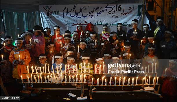 Pakistani students from different colleges and universities light candles and release lanterns in the sky in front of historical greater iqbal park...