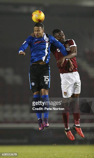 Gabriel Zakuani of Northampton Town contests the ball with Joe Thompson of Rochdale during the Sky Bet League One match between Northampton Town and...