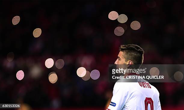 Sevilla's Argentinian forward Luciano Vietto celebrates a goal with teammates during the Spanish league football match Sevilla FC vs Malaga CF at the...
