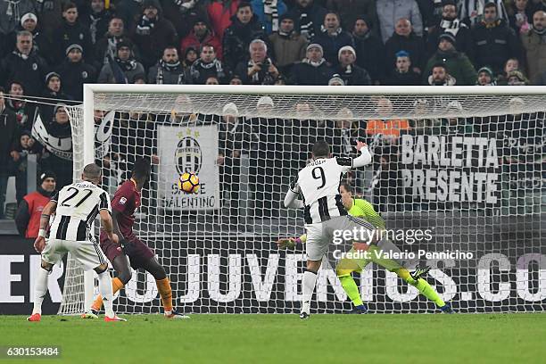 Gonzalo Higuain of Juventus FC scores the opening goal during the Serie A match between Juventus FC and AS Roma at Juventus Stadium on December 17,...