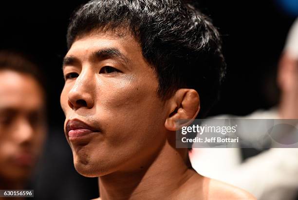 Takeya Mizugaki of Japan prepares to enter the Octagon before facing Eddie Wineland in their bantamweight bout during the UFC Fight Night event...