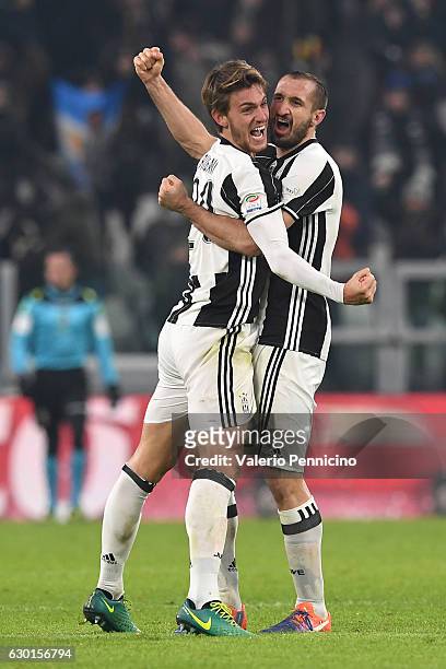 Daniele Rugani and Giorgio Chiellini of Juventus FC celebrate victory at the end of the Serie A match between Juventus FC and AS Roma at Juventus...