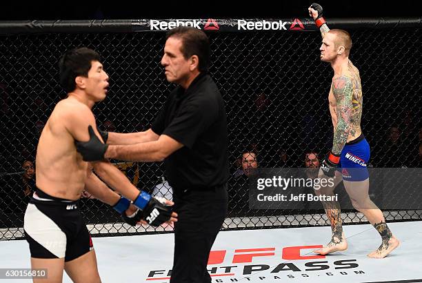 Eddie Wineland celebrates his victory over Takeya Mizugaki of Japan in their bantamweight bout during the UFC Fight Night event inside the Golden 1...