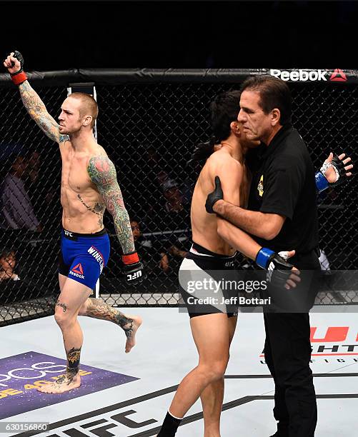 Eddie Wineland celebrates his victory over Takeya Mizugaki of Japan in their bantamweight bout during the UFC Fight Night event inside the Golden 1...