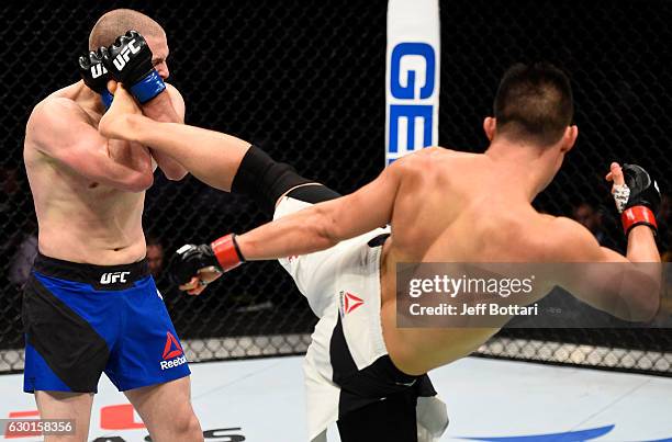 James Moontasri kicks Alex Morono in their welterweight bout during the UFC Fight Night event inside the Golden 1 Center Arena on December 17, 2016...