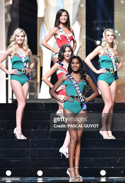 Contestants including Miss Ile-de-France Meggy Pyaneeandee appear on stage during the Miss France 2017 beauty contest on December 17, 2016 in...