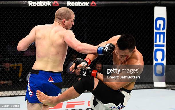 Alex Morono lands a spinning back fist against James Moontasri in their welterweight bout during the UFC Fight Night event inside the Golden 1 Center...