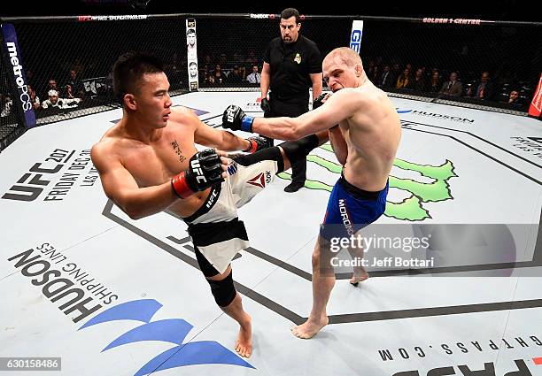 James Moontasri kicks Alex Morono in their welterweight bout during the UFC Fight Night event inside the Golden 1 Center Arena on December 17, 2016...