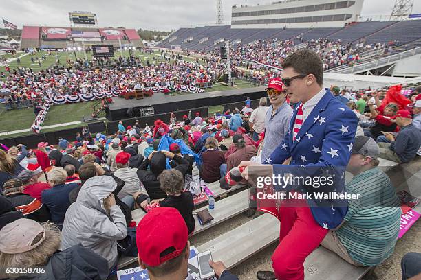Trump supporter John Gallops, from Daphne, AL, joins others for a president-elect Donald Trump thank you rally at Ladd-Peebles Stadium on December...