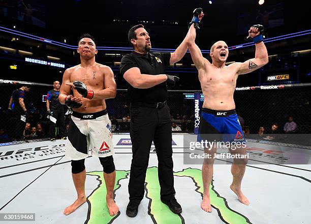 Alex Morono celebrates after his victory over James Moontasri in their welterweight bout during the UFC Fight Night event inside the Golden 1 Center...