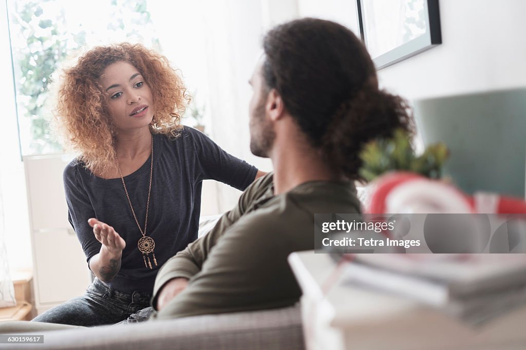 Young couple arguing at home