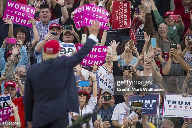 Supporters wave as president-elect Donald Trump arrives for a thank you rally in Ladd-Peebles Stadium on December 17, 2016 in Mobile, Alabama....