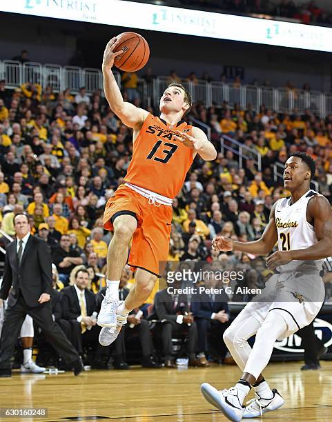 Guard Phil Forte III of the Oklahoma State Cowboys scores with a lay up against the Wichita State Shockers during the first half on December 17, 2016...