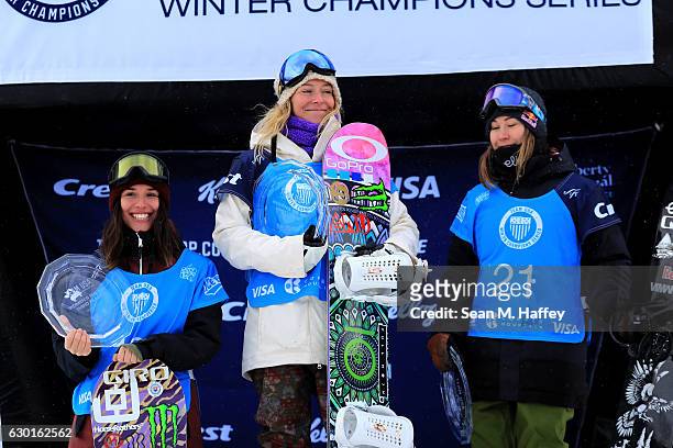 Enni Rukajarvi of Finland in second place, Jamie Anderson in first place and Klaudia Medlova from Slovakia in third celebrate on the podium in the...