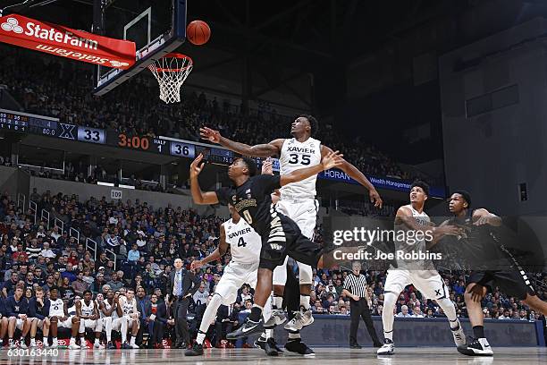 RaShid Gaston of the Xavier Musketeers defends against Brandon Childress of the Wake Forest Demon Deacons in the first half of the game at Cintas...