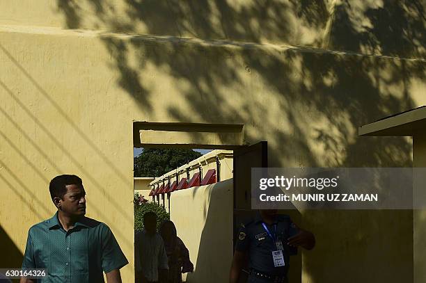 In this photograph taken on November 2 Bangladeshi visitors walk in the grounds of Dhaka Central Jail in Dhaka. Bangladesh prison authorities have...