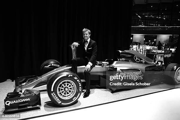 Nico Rosberg, Formula One, F1 driver and World Champion 2016 sits on his car with trophy during the ADAC sportgala 'Die Nacht der Sieger 2016' on...