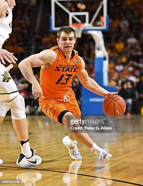 Guard Phil Forte III of the Oklahoma State Cowboys drives with the ball against the Wichita State Shockers during the first half on December 17, 2016...