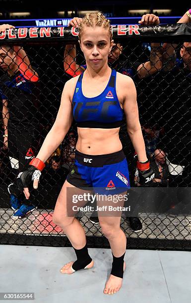 Paige VanZant stands in the Octagon before her women's strawweight bout against Michelle Waterson during the UFC Fight Night event inside the Golden...