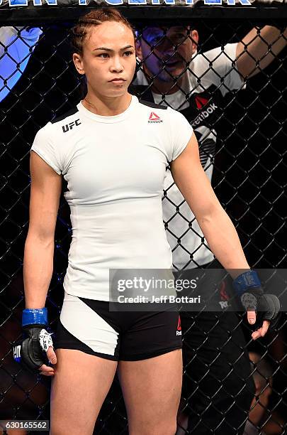 Michelle Waterson stands in the Octagon before her women's strawweight bout against Paige VanZant during the UFC Fight Night event inside the Golden...