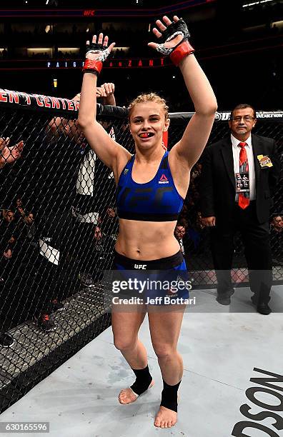 Paige VanZant stands in the Octagon before her women's strawweight bout against Michelle Waterson during the UFC Fight Night event inside the Golden...