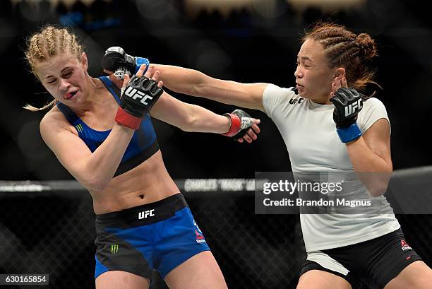 Michelle Waterson punches Paige VanZant in their women's strawweight bout during the UFC Fight Night event inside the Golden 1 Center Arena on...