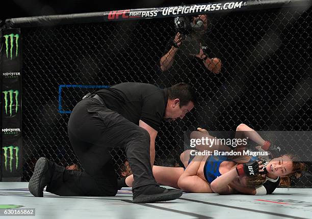 Michelle Waterson attempts to submit Paige VanZant in their women's strawweight bout during the UFC Fight Night event inside the Golden 1 Center...