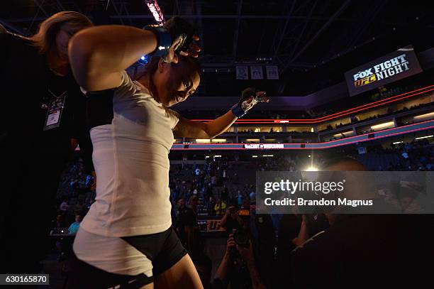 Michelle Waterson celebrates her submission victory over Paige VanZant in their women's strawweight bout during the UFC Fight Night event inside the...