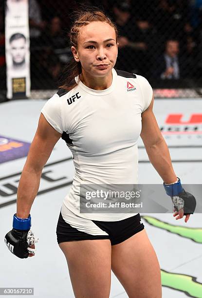 Michelle Waterson celebrates after her submission victory over Paige VanZant in their women's strawweight bout during the UFC Fight Night event...