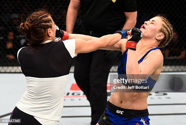 Michelle Waterson and Paige VanZant trade punches in their women's strawweight bout during the UFC Fight Night event inside the Golden 1 Center Arena...