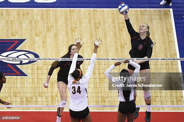 Kathryn Plummer of Stanford University hits a ball to Texas players during the Division I Women's Volleyball Championship held at Nationwide Arena on...