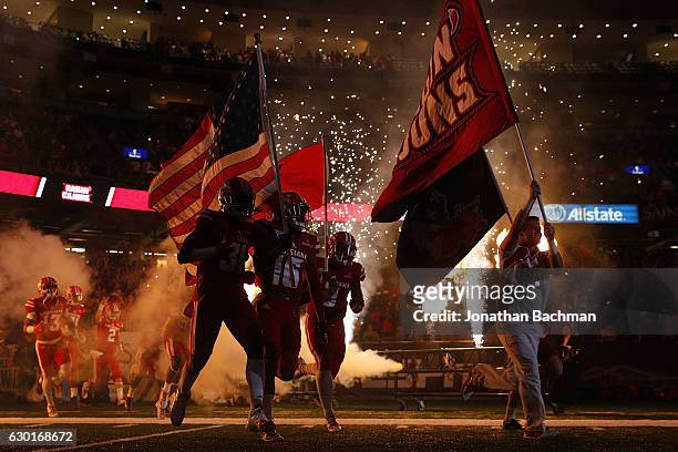 The Louisiana-Lafayette Ragin Cajuns take the field before a game against the Southern Miss Golden Eagles at the Mercedes-Benz Superdome on December...