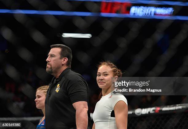 Michelle Waterson celebrates her victory over Paige VanZant in their women's strawweight bout during the UFC Fight Night event inside the Golden 1...